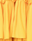 Az Factory Lutz Huelle Marilyn Dress. Bright yellow summer dress in trapeze style. With a v neck and volumnous a-line body and ruffled bottom. Close up of ruffled details.