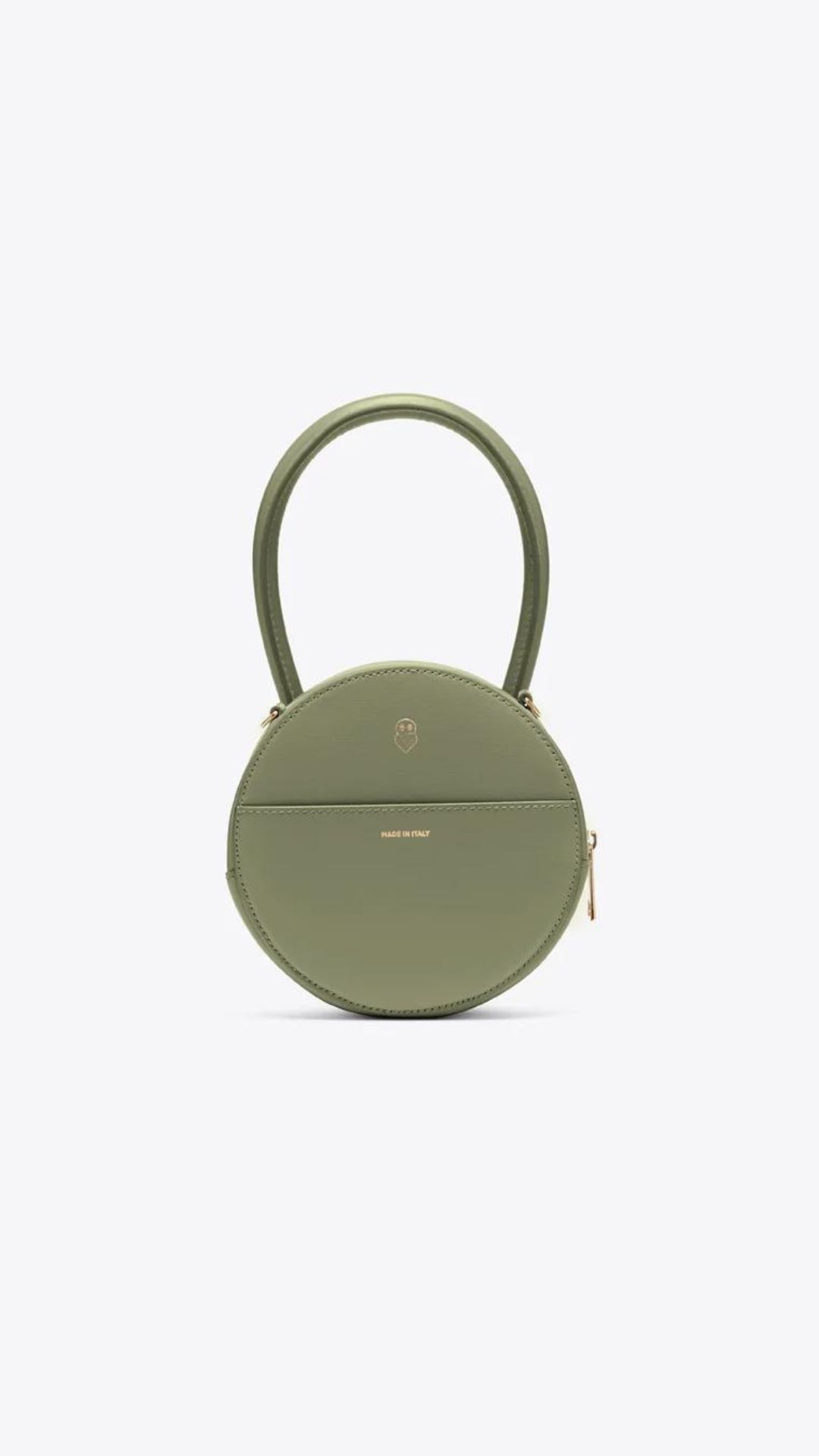 AZ Factory Round Cake Bag in Light Khaki Handcrafted in Italy with sustainable overstock leather, this bag features our AZ Amigo face design, a single extended top handle, and an attachable and adjustable leather cross-body strap. Complete with a zip closure and back pocket, back view.