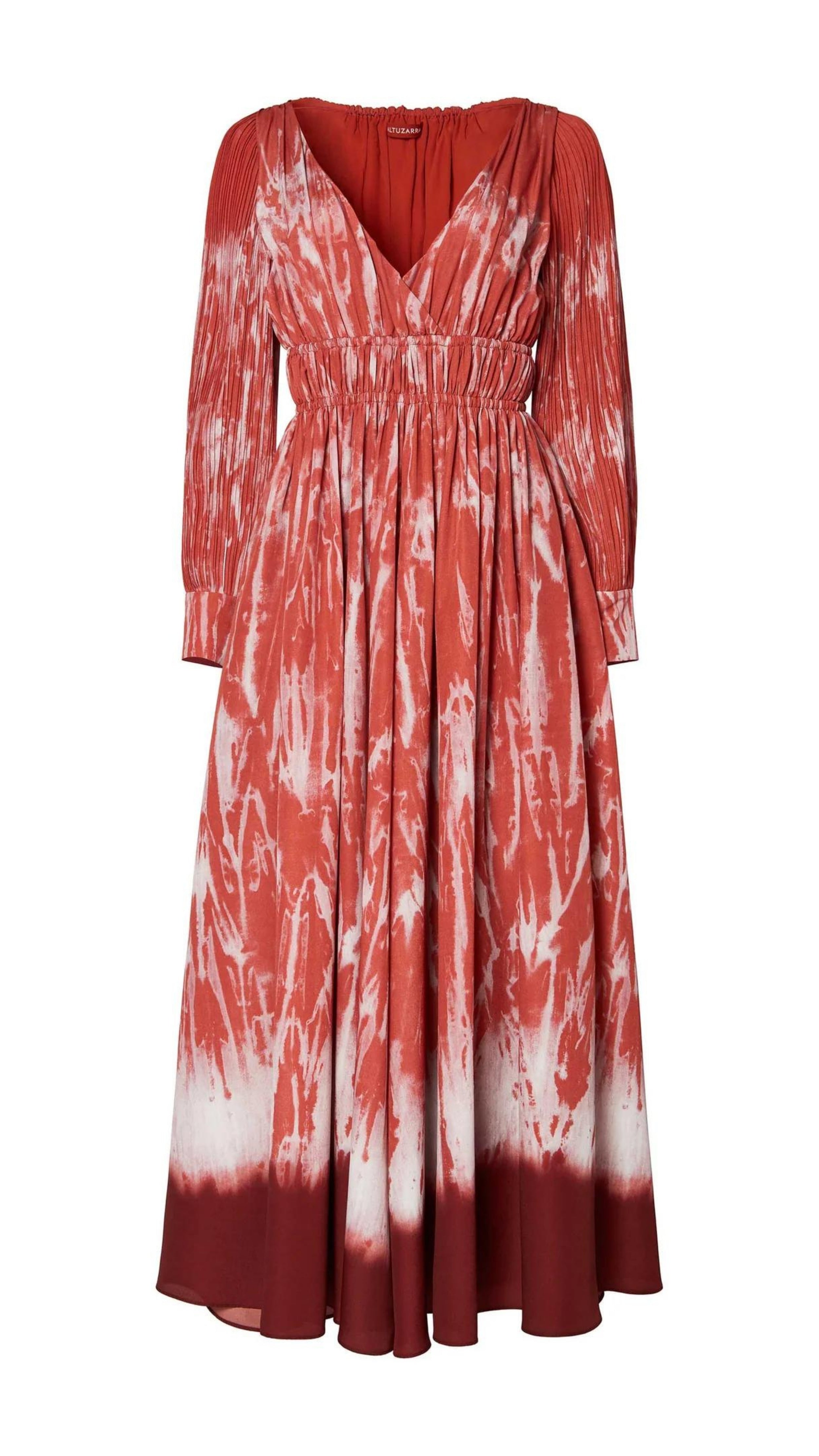 Altuzarra Kathleen Dress The Kathleen Dress is a statement dress using Altuzarra's renowned Shibori dyeing technique in shades of red, cranberry and orange. It has a maxi silhouette, a V-neckline, a ruched waist, long pleated sleeves, and button-fastening cuffs. Product photo flat.