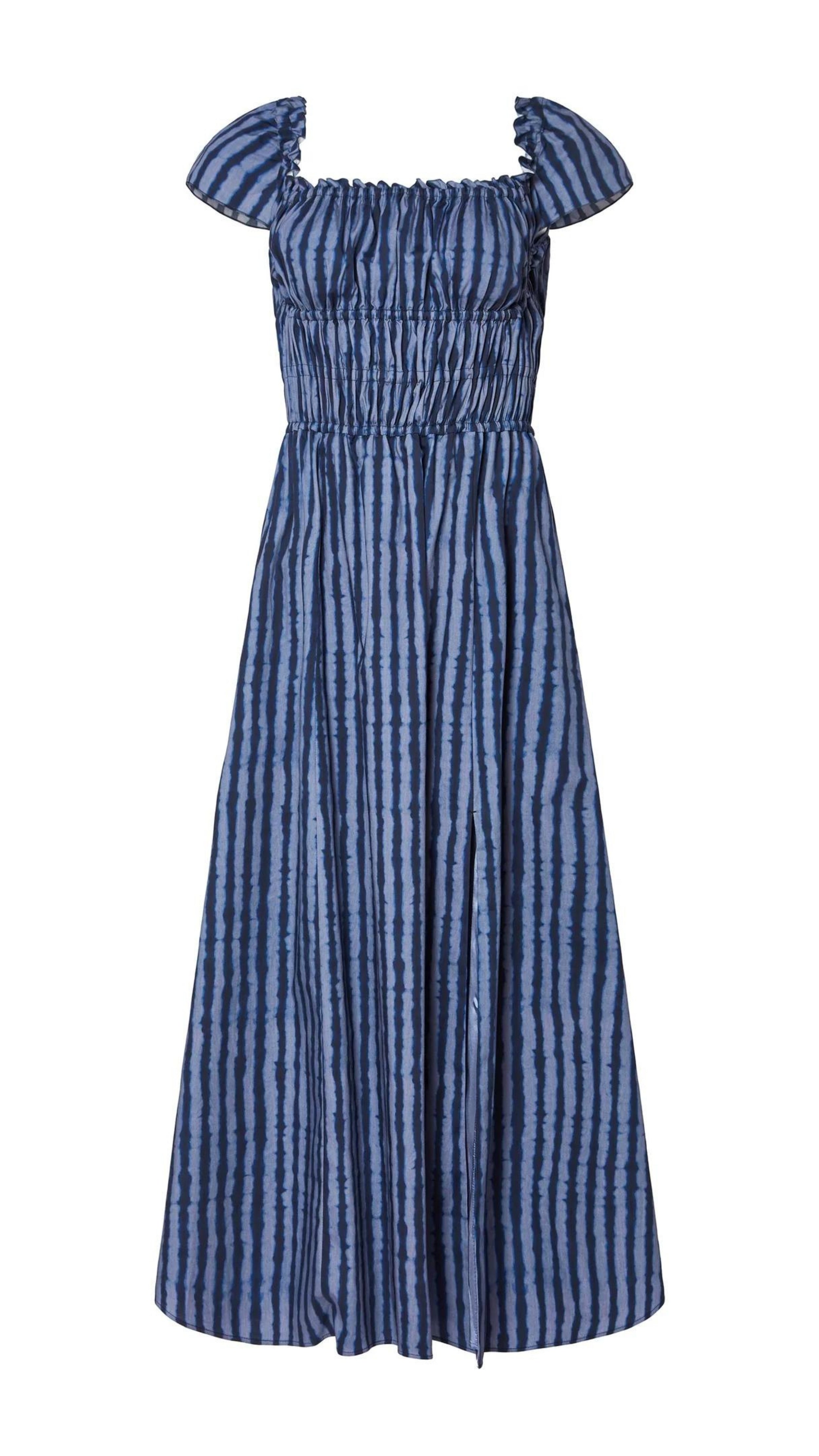 Altuzarra Lily Dress The 'Lily' dressmade from soft cotton. The midi dress  features a smocked construction and off-the-shoulder design. It has hidden pockets and a side slit in the skirt. In tones of blue. Product photo flat.