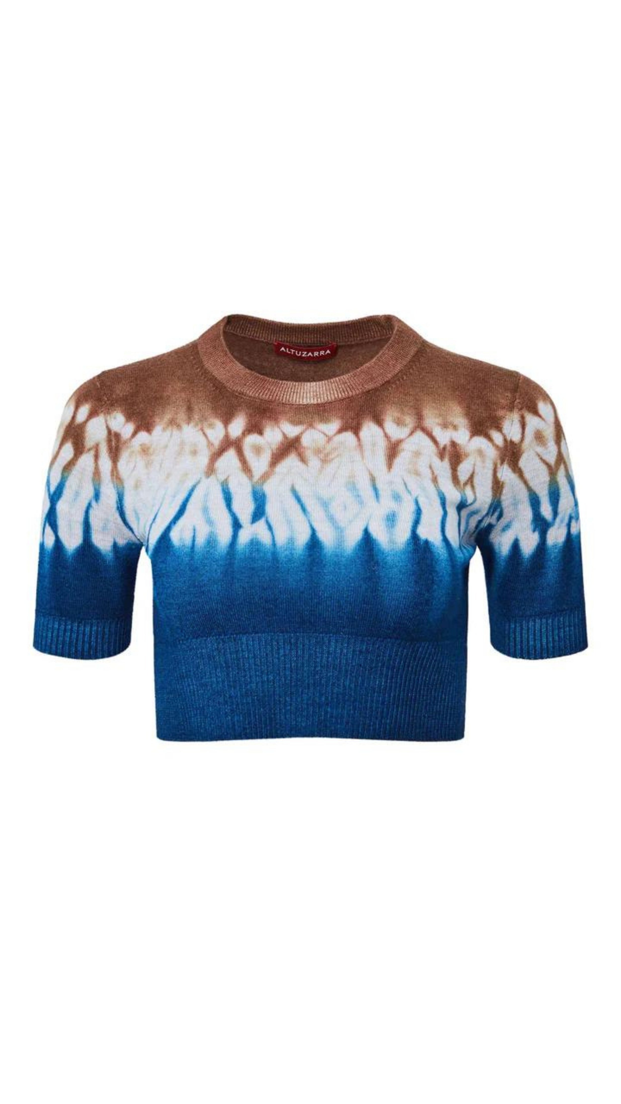 Altuzarra Nicholas Sweater. Made in Italy from soft superfine merino wool. This cropped style sweater features a unique blend of ultramarine blue and brown hues, created using Altuzarra's Shibori dyeing technique. This summer knit top features cap sleeves and a crew neckline. Shown flat from the front.