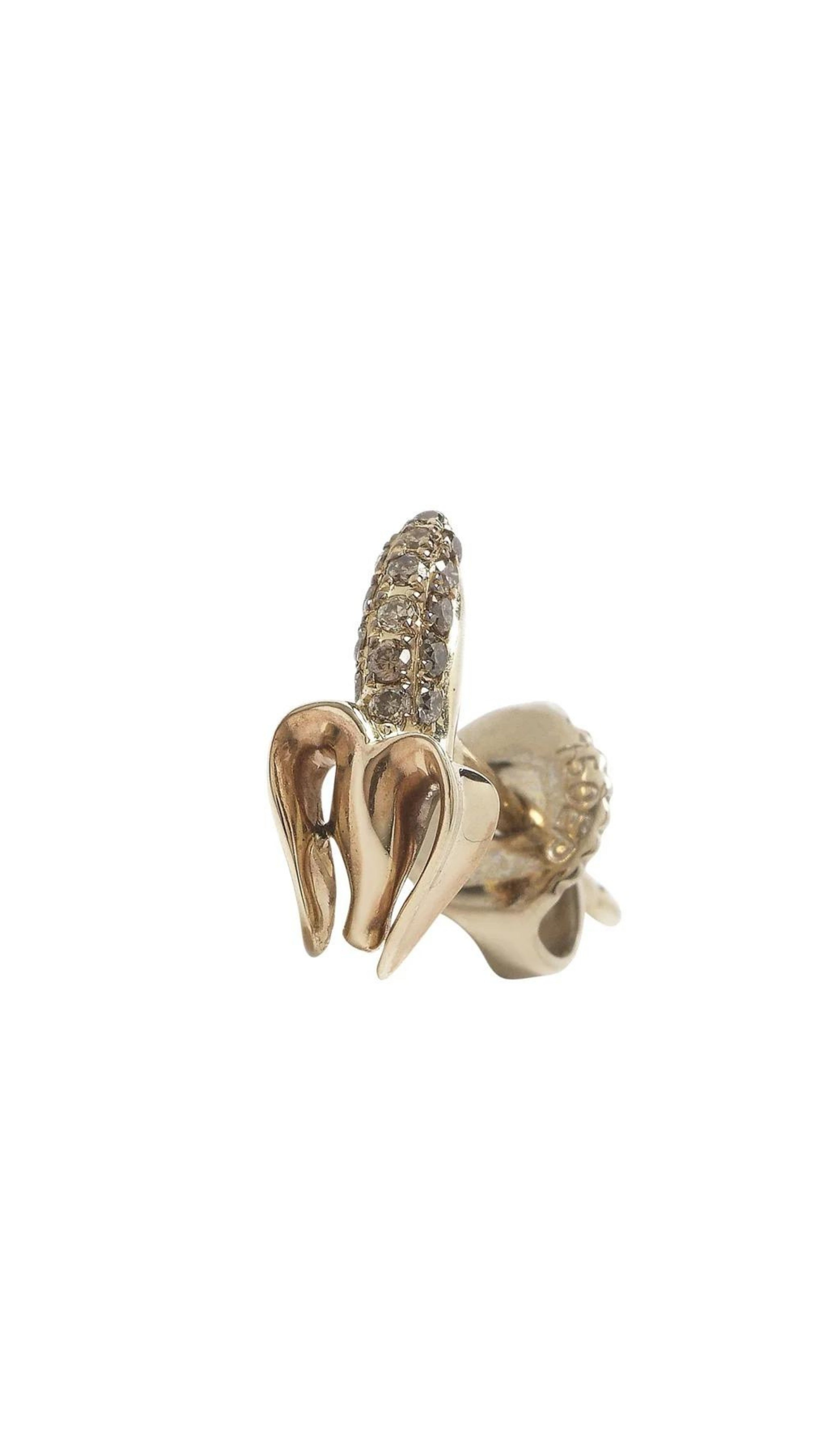 Bibi van der Velden Monkey Mini Banana Stud in Diamond. Single stud earring crafted in the shape of a partially peeled banana. The peel is made from 18K gold and the banana is pave with diamonds. Stud. Photo shows earring from the front and side angle.