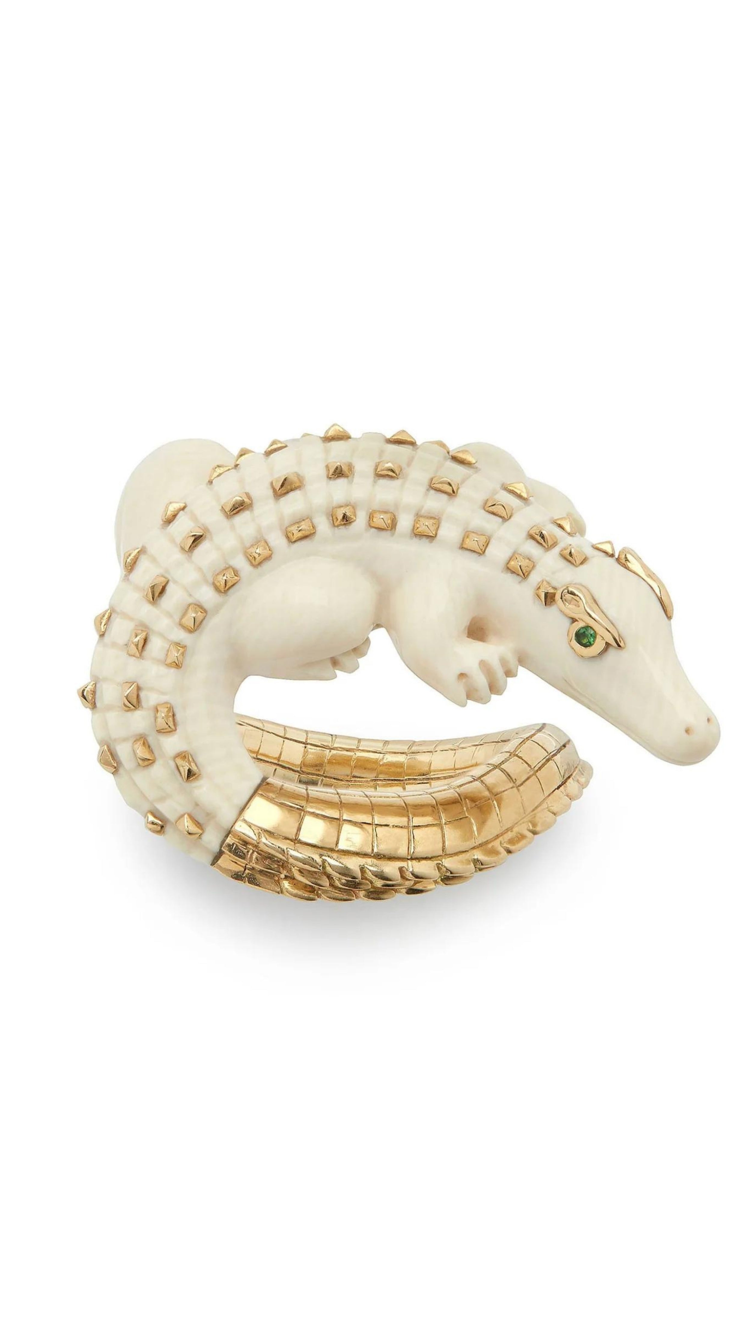 Bibi van der Velden Mammoth Alligator Twist Ring. Crafted in mamoth tusk in the shape of an alligator that curves around the finger. The tail is made from 18K gold and the ivory body has 18K gold studs. The ring is shown from above.