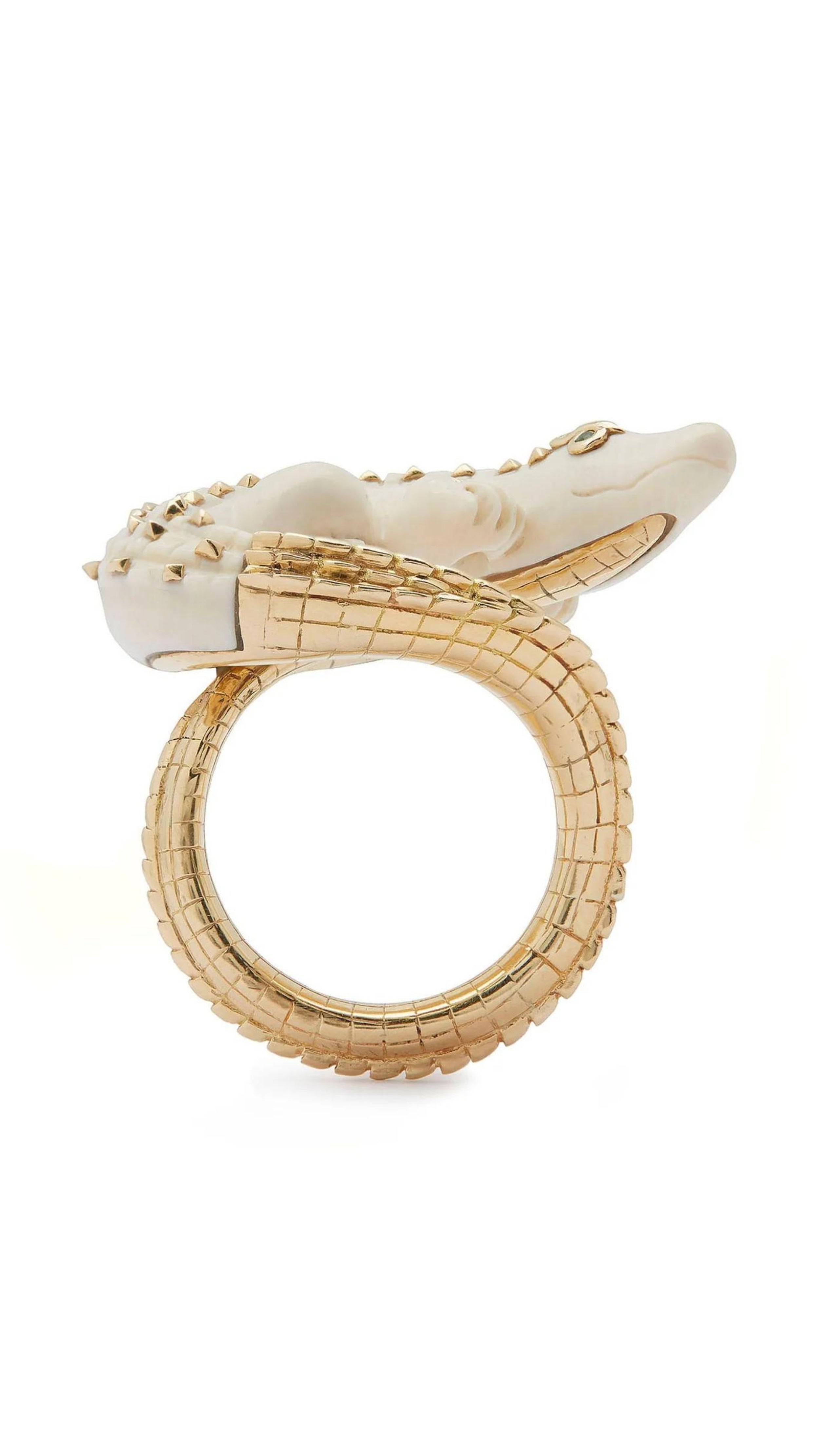 Bibi van der Velden Mammoth Alligator Twist Ring. Crafted in mamoth tusk in the shape of an alligator that curves around the finger. The tail is made from 18K gold and the ivory body has 18K gold studs. The ring is shown from the bottom