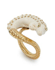Bibi van der Velden Mammoth Alligator Twist Ring. Crafted in mamoth tusk in the shape of an alligator that curves around the finger. The tail is made from 18K gold and the ivory body has 18K gold studs. The ring is shown from an angle.
