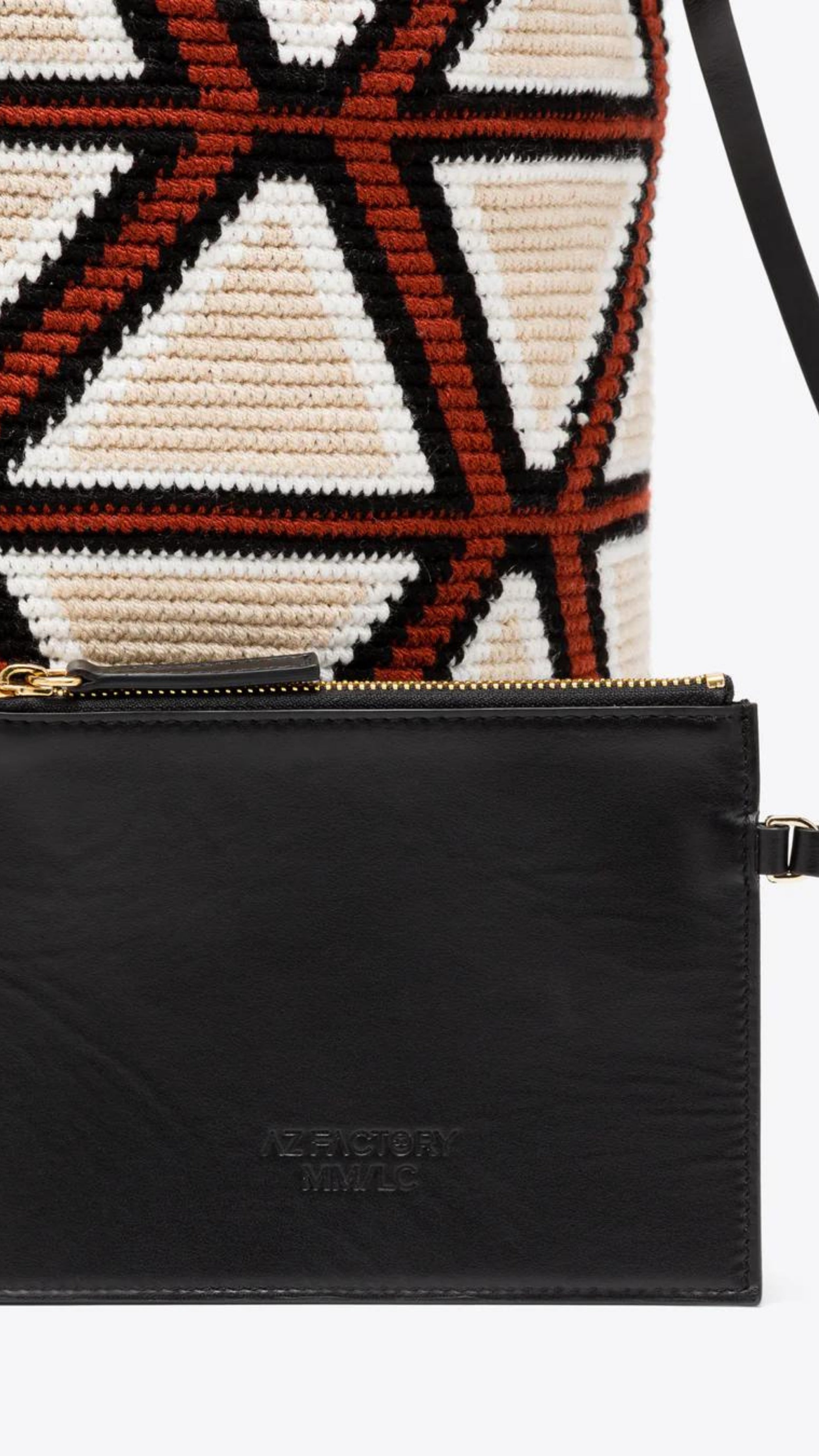 AZ Factory Colville Molly Molloy Lucinda Chambers, WOVEN CABRAS BAG  The Cabras Bag is woven in Wayuu Colombian and finished with Italian leather craftsmanship. Its ecru and burgundy diamond pattern is enhanced with black leather trim and a long black tassel. Shown with the interior leather pouch.