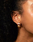 Model wearing the Milamore Kintsugi Duo Pearl Earring with a Gold South Sea pearl.