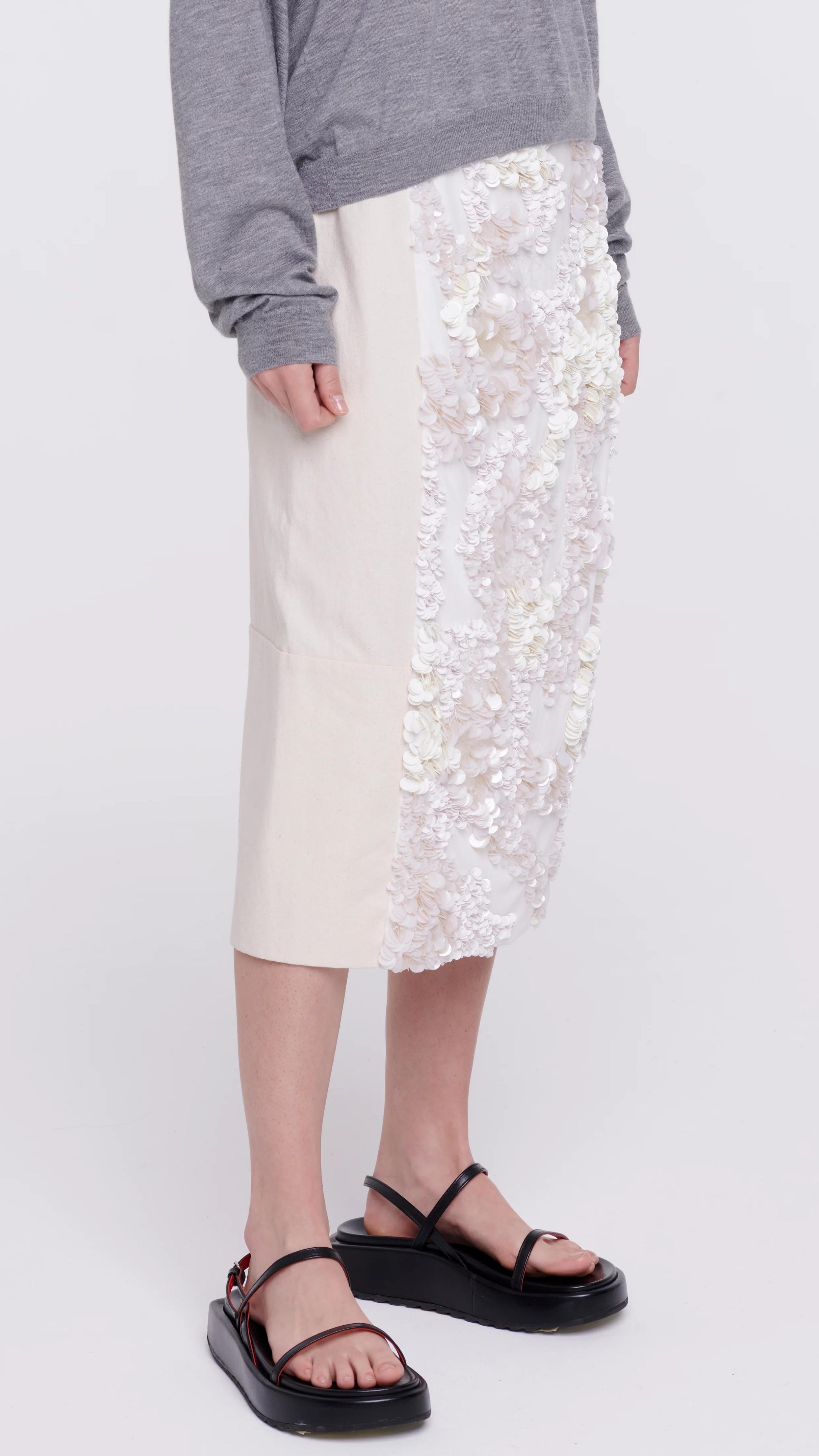Plan C Panama Sequined Midi Skirt, Cotton panama midi skirt crafted in Italy with front panel of white sequins. This skirt has a contrasting black elastic waistband. The skirt falls to knee length. 