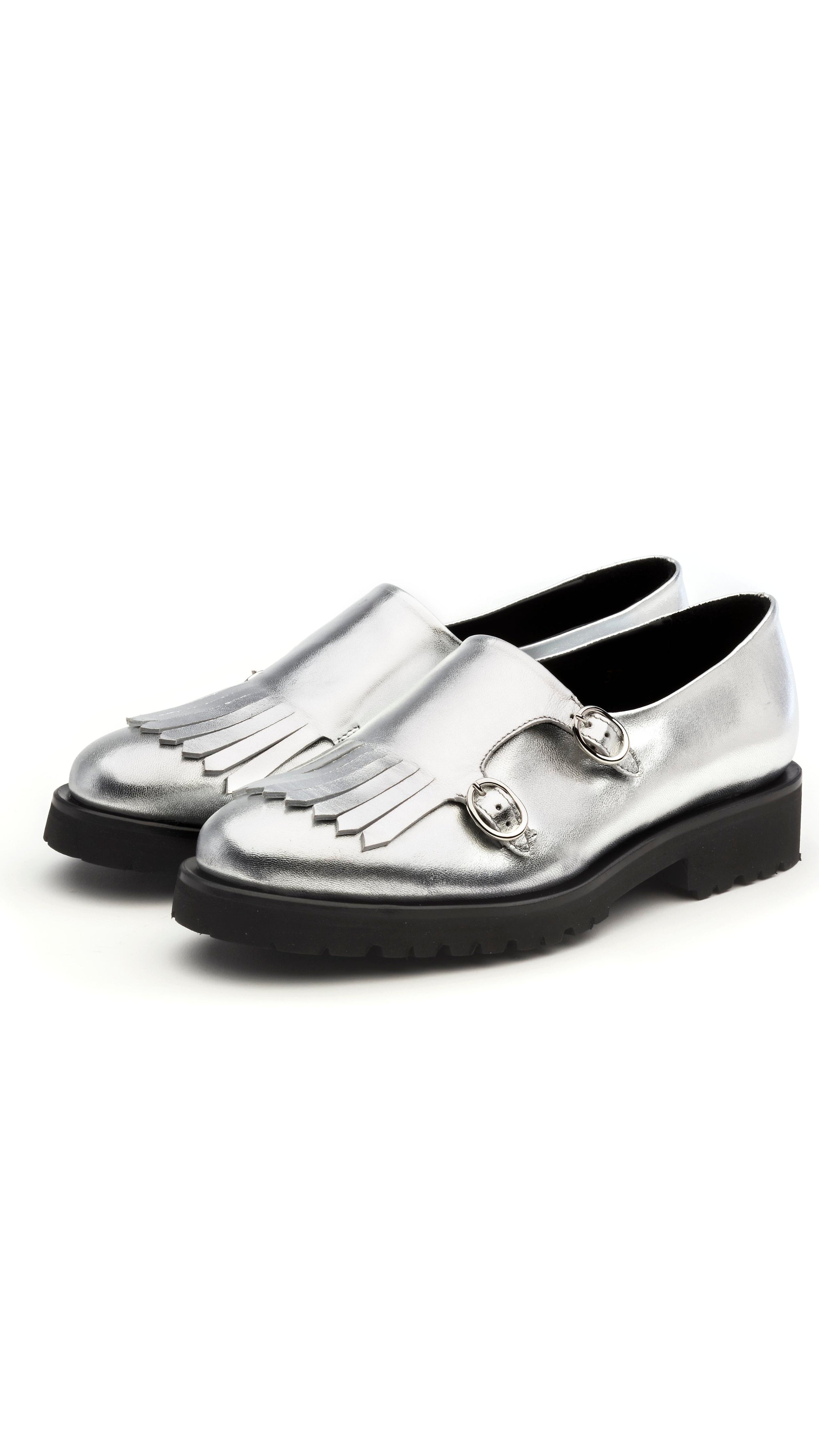 Rupert Sanderson The Cedar Brogues are handcrafted in Italy with luxurious soft metallic silver calf skin. They have side buckles and fringing to the toe for a distinctive finish. The 10mm platform heel. Facing front and side.