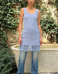Dodo Bar Or Joe Long Top n Sky Blue. Hand crocheted in 100% cotton, this is a sleeveless style with rounded neck and low scooped back. The bottom hem is fringed. This photo shows the model wearing the blouse from the front.