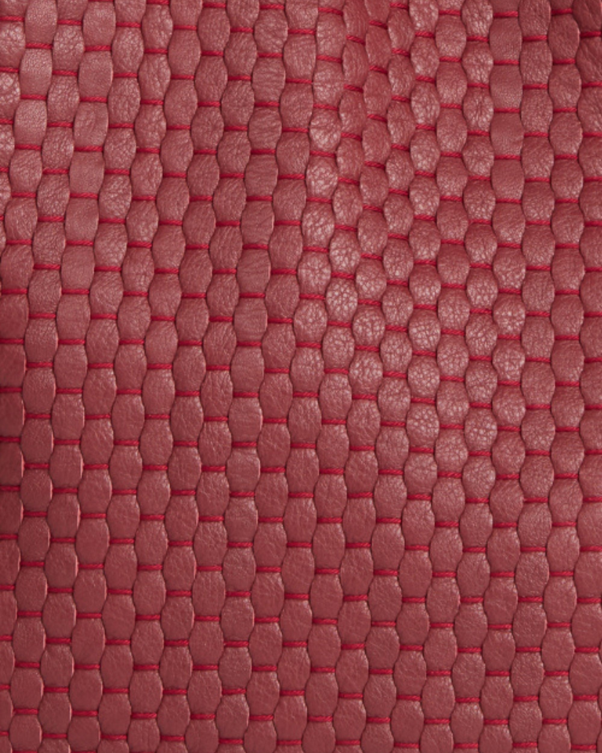 Close-up of Parise ‘1312’ Handbag in Chianti showing detailed woven leather texture and artisanal craftsmanship.