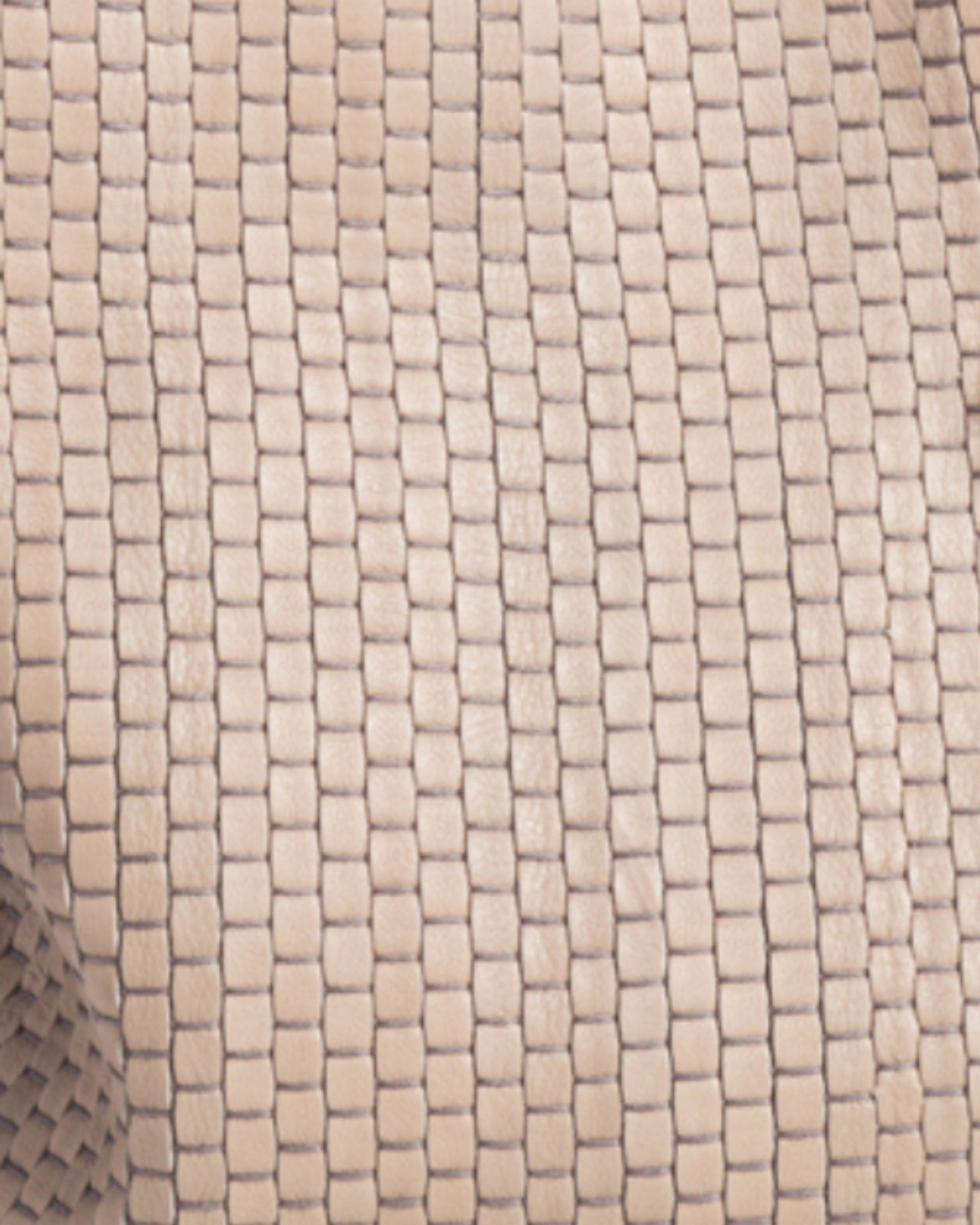 Close-up of Parise ‘81’ Baguette Bag in Acacia showing artisanal handwoven leather crafted on 18th-century Venetian looms.