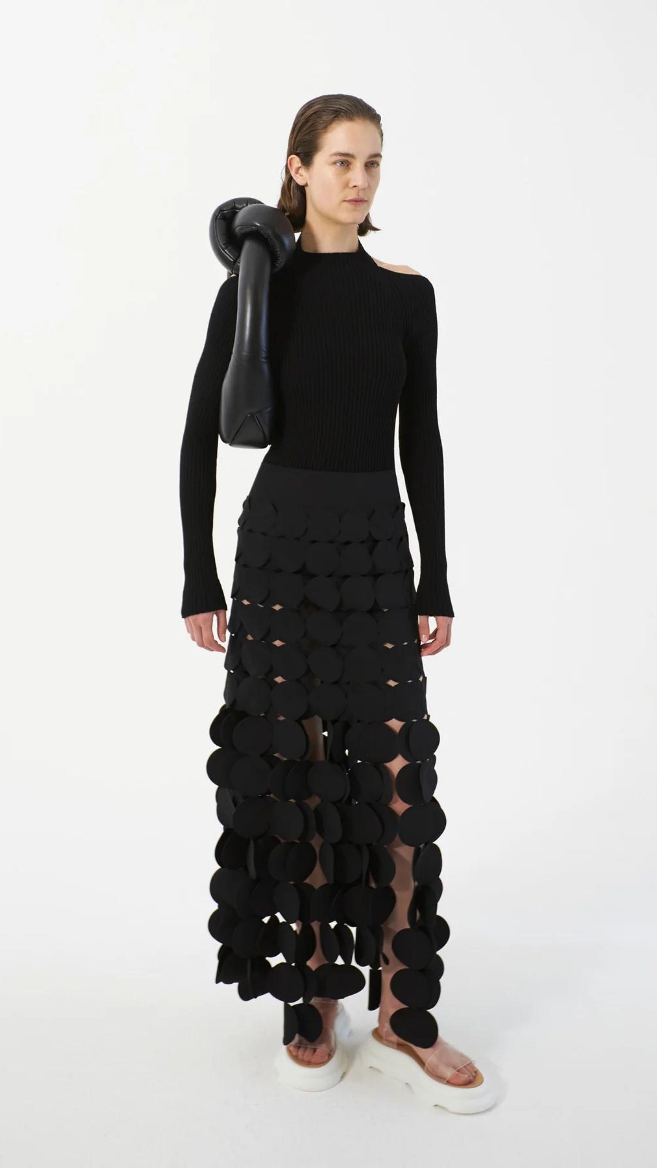 AWAKE Mode Laser Cut Multi Circle Double Layer Skirt. Icon AWAKE Mode circle skirt with a double layer to cover the right areas. With an elastic waist and the circle layers midi to maxi length. Shown on a model facing front.