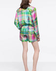 AZ Factory Chromatic Love Silk Blouse. Elastic waist silk shorts in multi color plaid with Alber Elbaz sketches on top. Shown on model facing back.