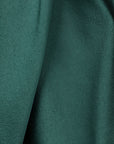 AZ Factory Colville Molly Molloy Lucinda Chambers, Asymmetric Satin Tee Shirt. Elegantly draped in forest green satin material in a classic tee shirt shape. Detail of material.