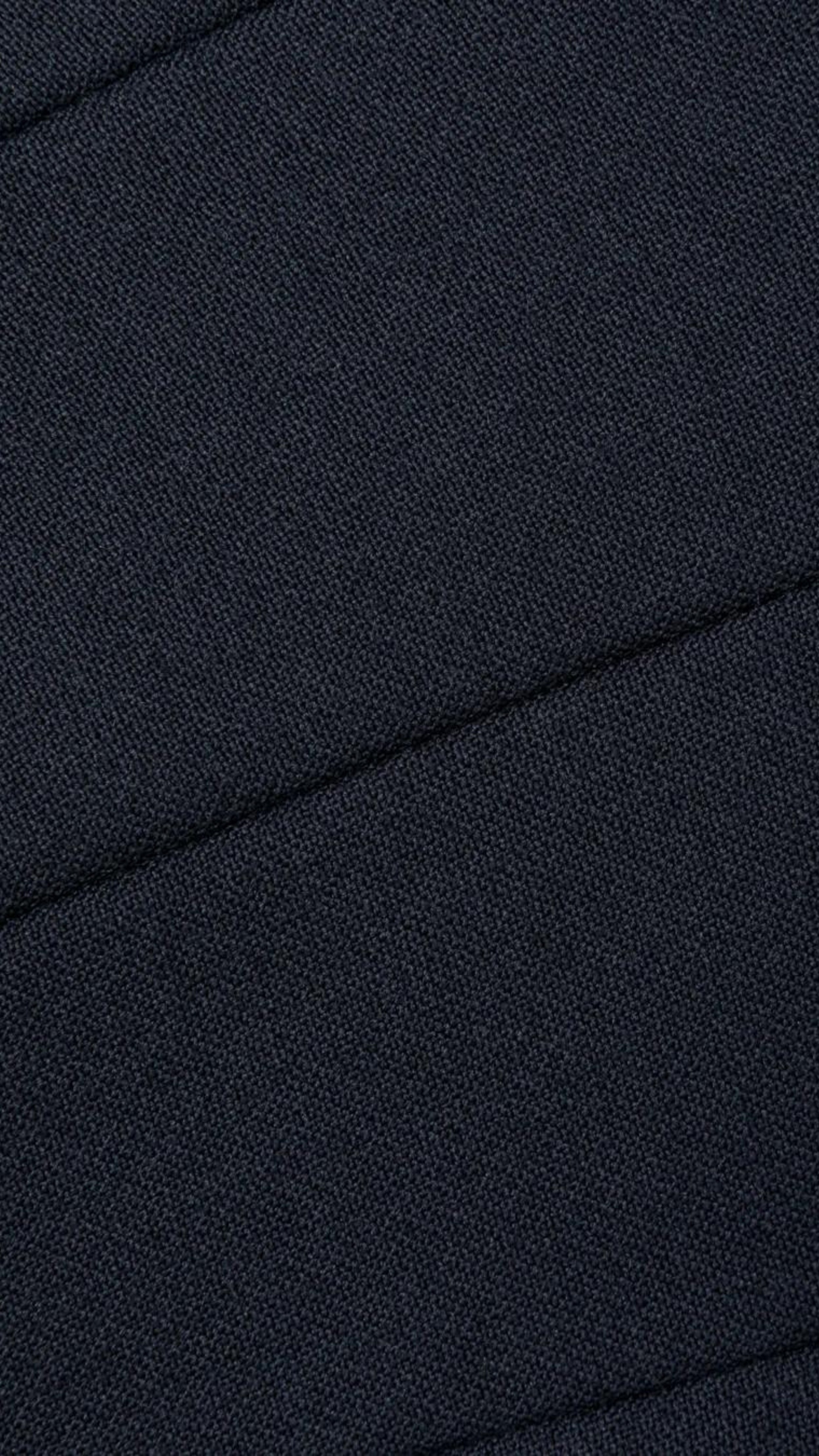 AZ Factory Colville Molly Molloy Lucinda Chambers, Draped Wool Coat in Navy. Wrap around wool coat made in Italy in navy blue. It has an ecru lining and can be worn open or belted for a more fitted style. Close up of fabric.
