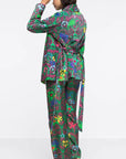 AZ Factory Shawl Collar Jacket in Motly Paisley. This lightweight, belted jacket boasts an all-over printed velvet fabric, tie belt, front patch pockets, butterfly lining, and piping details for an extra touch of elegance. Shown on model facing back.