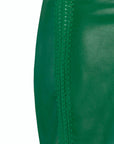 Alejandra Alonso Rojas Leather Mini Skirt with Crochet Seams. Crafted in super soft lamb leather with front and back silk crochet seams in a kelly green. This is a front facing product photo with detail to the silk crochet seam lines.