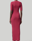 Altruzarra, Argolis Dress. Rose pink colored ribbed knit dress. Body hugging with flattering, slimming from waist detail. It has a rounded collar, half short sleeves and midid length. There are two side slits to the knee. Shown on model facing back. Available at experience 27 in madrid spain.
