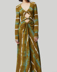 Altruzarra, Helenos Dress. 100% silk and shibori dyed in beautiful olive green and ecru pattern with a highlight pop of blue/green. It features a v neckline, long sleeves and a full skirt with front cut out and twist details. This pre-fall 2023 dress is shown on a model facing front. Available at experience 27 in madrid, spain.