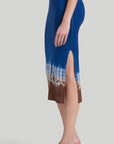 Altuzarra 'Morse' skirt, featuring Altuzarra's iconic Shibori tie-dye technique in brown, white, and blue. Made from 100% Superfine Merino 130's wool, this high-rise pencil silhouette midi length skirt. Shown on model facing side.