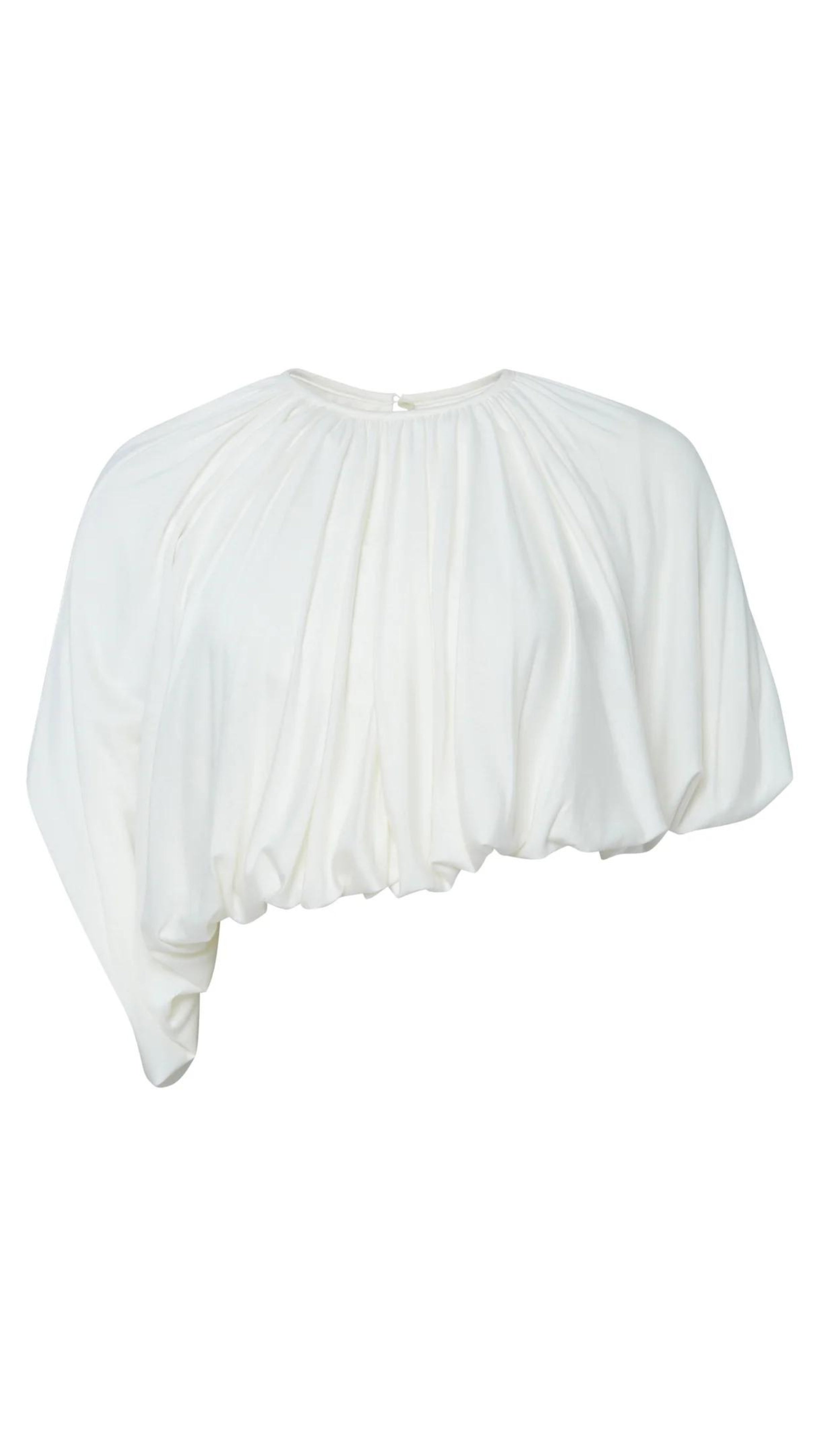 Altuzarra Naxos Top in Ivory. Draped jersey create a fluid look with an asymmetrical hemline. Product photo shown facing front.