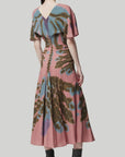 Altuzarra Pelopenese Dress. Rose pink, sky blue and green rorschach pattern midi dress. With a v neckline and soft draping half sleeves. Flowing skirt with waist line rouching. Shown on model facing to the back.