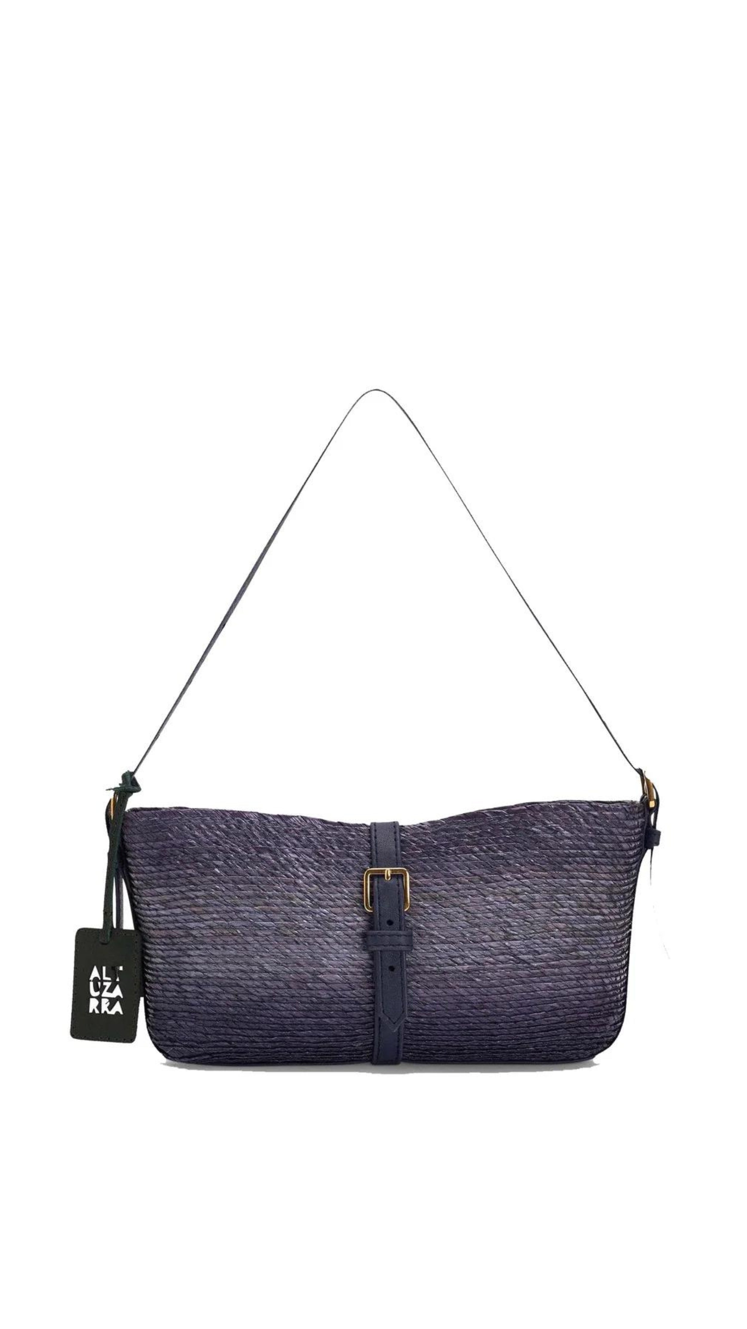 Altruzarra WATERMILL SHOULDER BAG in Murex. Raffia summer purse in deep blue tones and navy blue leather detailing and gold hardware. Adjustable strap for shoulder or long length. Shown from the front side. Available at Experience 27 Madrid Spain.