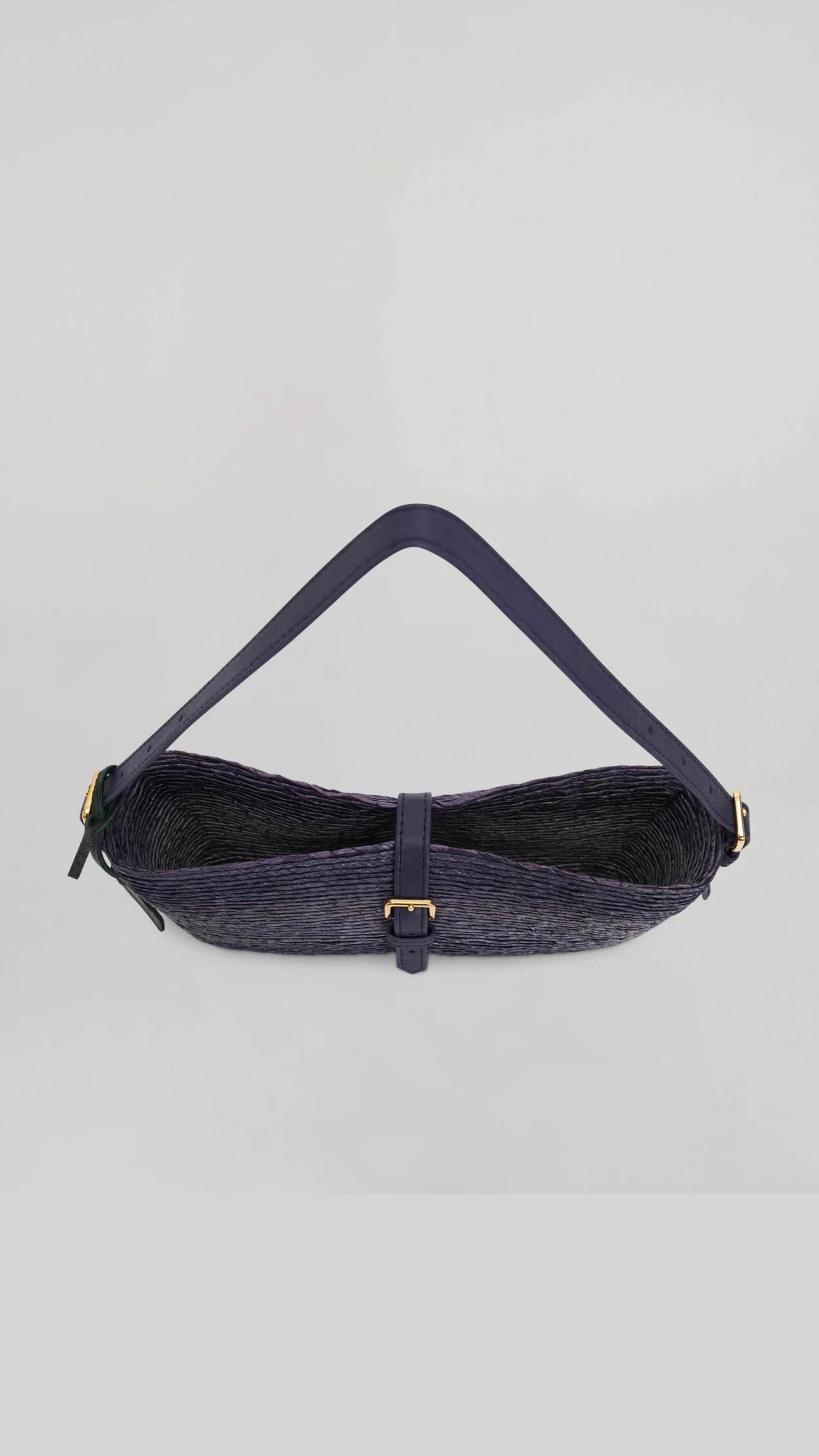 Altruzarra WATERMILL SHOULDER BAG in Murex. Raffia summer purse in deep blue tones and navy blue leather detailing and gold hardware. Adjustable strap for shoulder or long length. Shown from the top view. Available at Experience 27 Madrid Spain.
