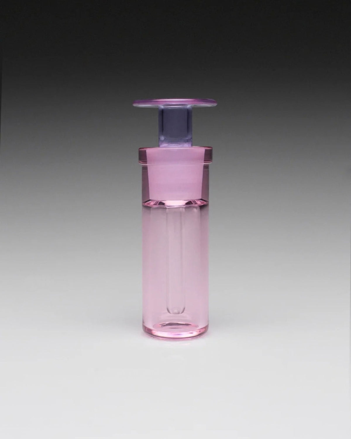 ARPA Matter 07 Eau de Parfum in a hand-blown pink glass bottle with violet pipette