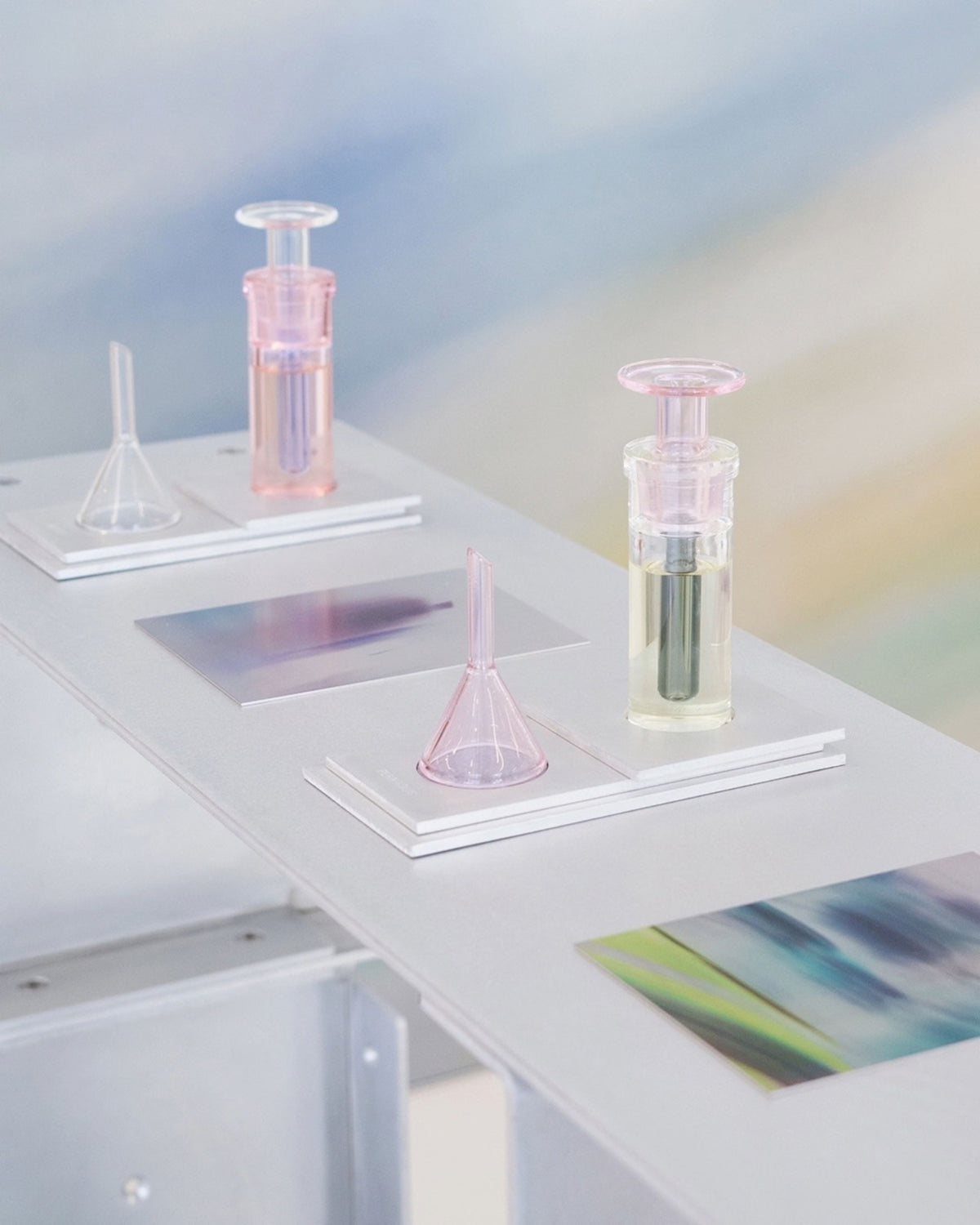 ARPA Matter 07 fragrance bottles displayed on translucent shelving in a pastel interior