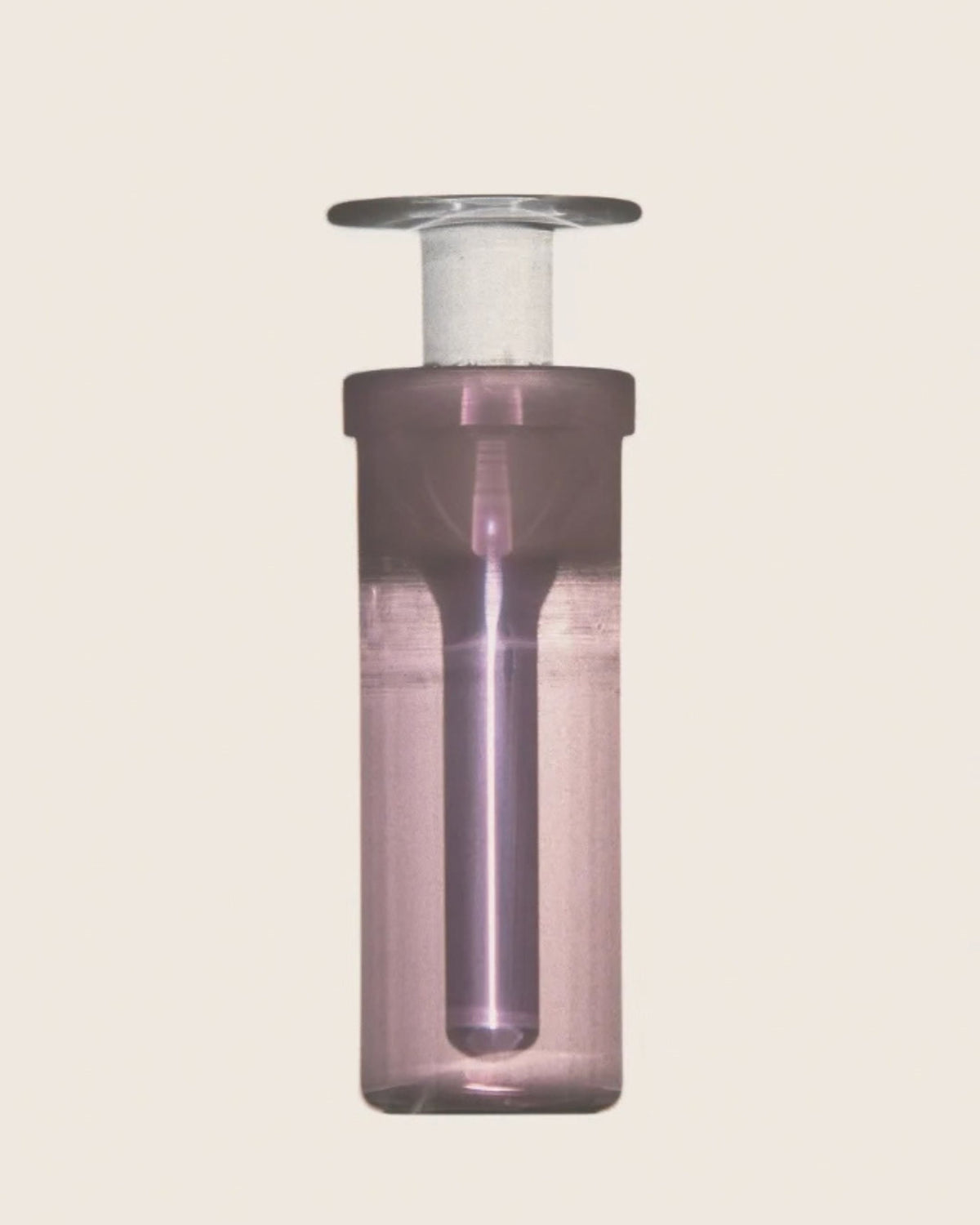 Close-up of the ARPA Matter 07 hand-blown pink glass fragrance bottle