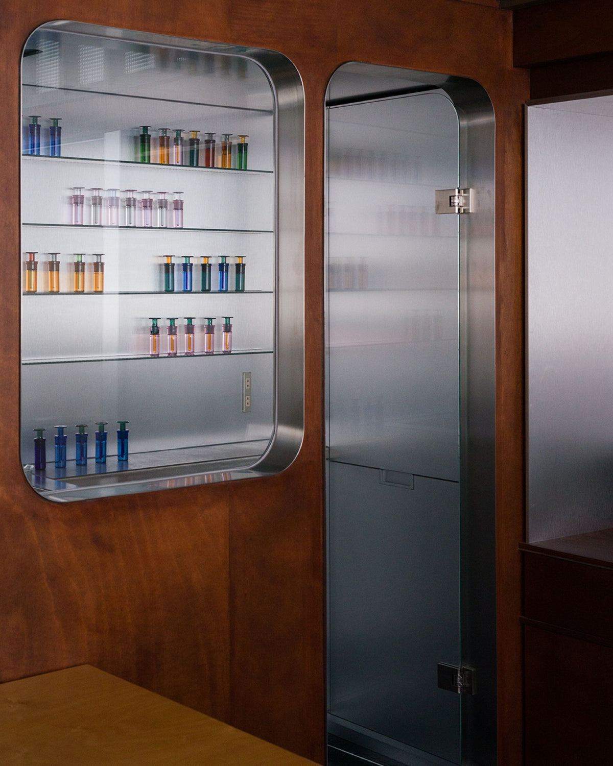 ARPA fragrances arranged inside an illuminated sensory installation