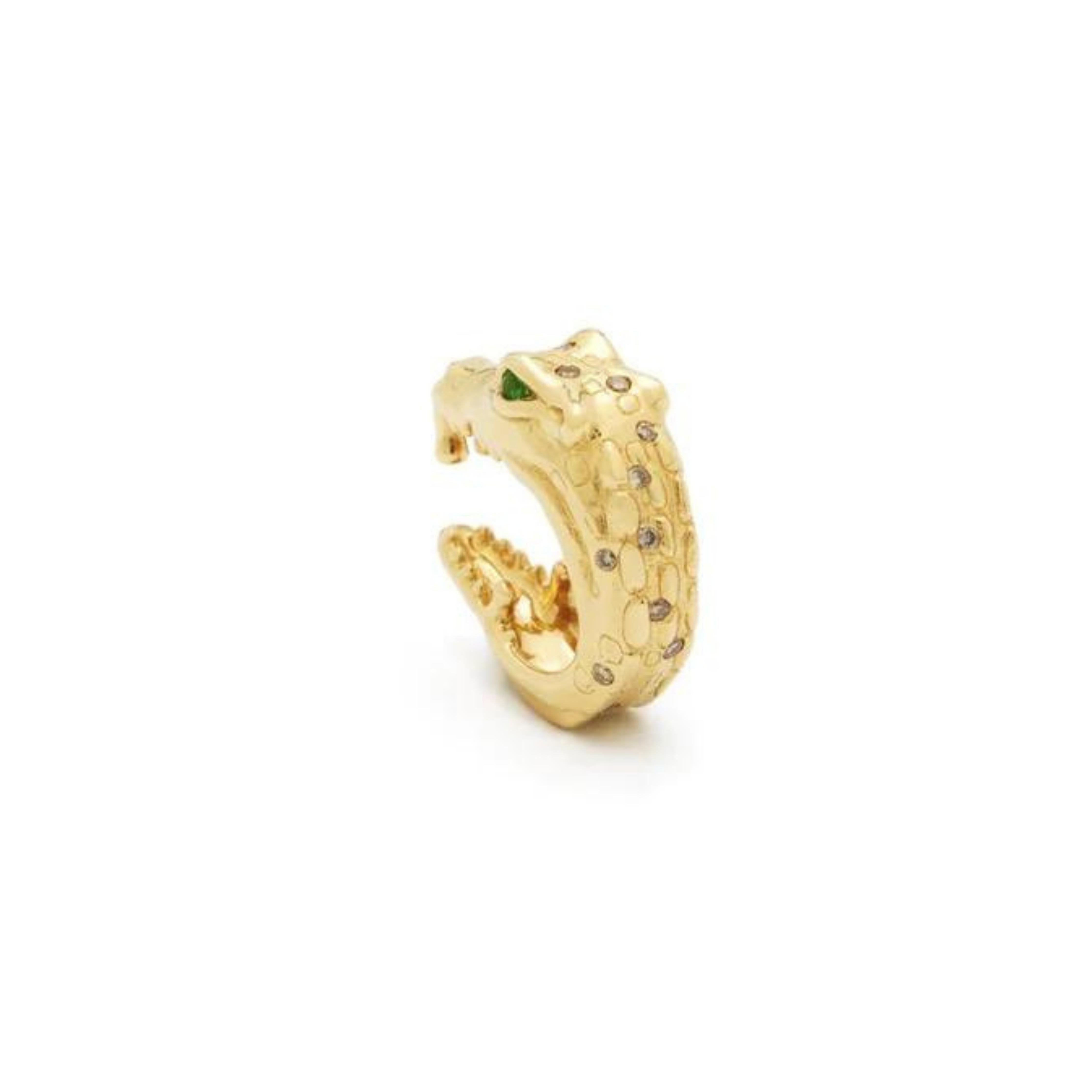 Bibi van der Velden Alligator Bite Earhugger. An ear cuff in the shape of a biting alligator. Made from 18K gold and emerald eyes with diamond accents. Photo shows ear cuff from the back view.