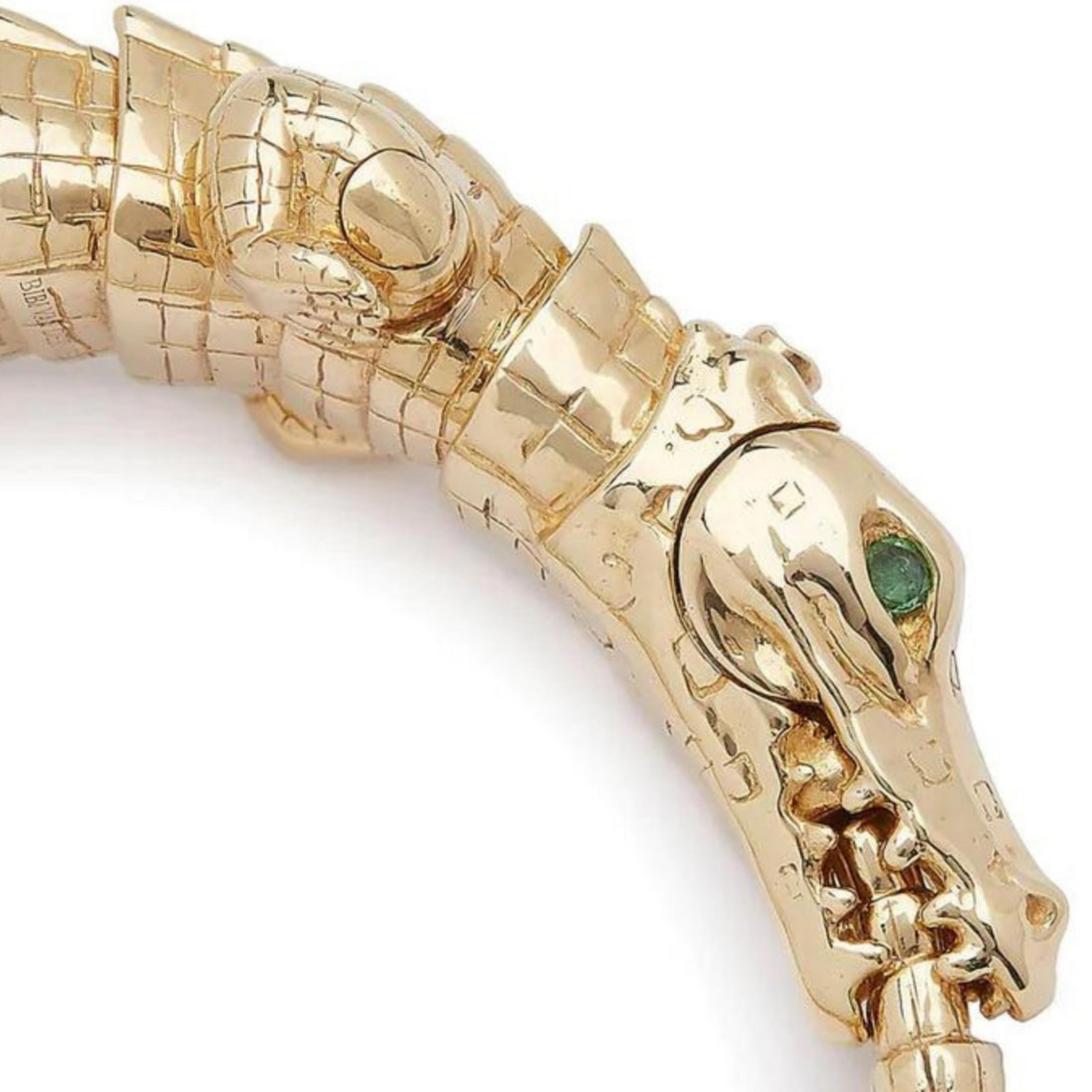 Bibi van der Velden Alligator Wrap Bracelet. A high fine jewelry piece of the most amazing quality and detail. This photo shows the entire 18K gold bracelet with tsavorite eye details from the side view. It includes detailed scales, carved legs and fluid internal pieces to make the bracelet curve perfect across the wrist.
