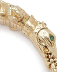 Bibi van der Velden Alligator Wrap Bracelet. A high fine jewelry piece of the most amazing quality and detail. This photo shows the entire 18K gold bracelet with tsavorite eye details from the side view. It includes detailed scales, carved legs and fluid internal pieces to make the bracelet curve perfect across the wrist.