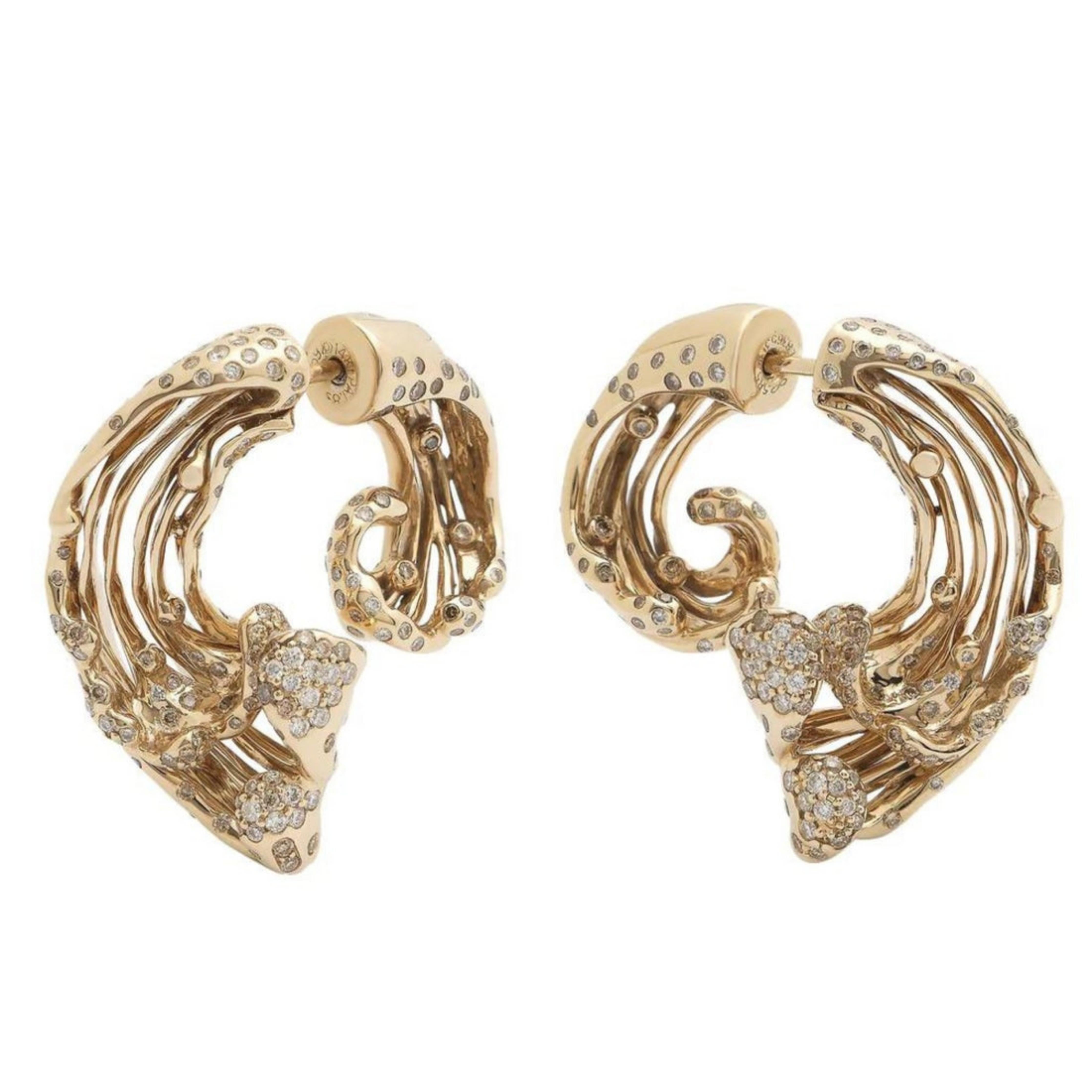 Bibi van der Velden Big Wave Earrings. Crafted from 18K Gold in the sculptural form of rolling waves, the crests of the waves are encrusted with white diamonds. The earrings go onto the ear at mid point, creating a dimensional look from both the front and back of the earring. Shown front view.