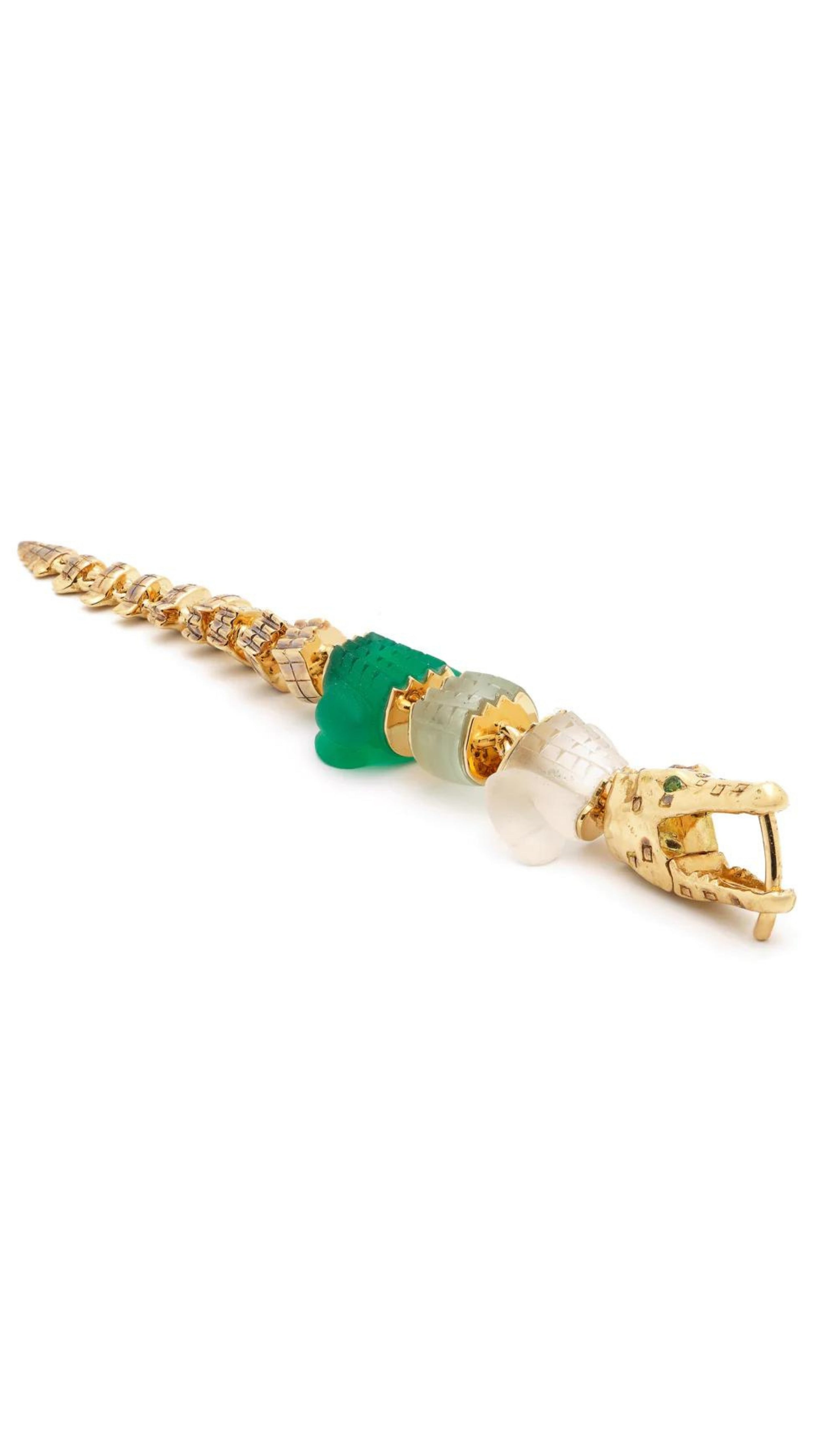 Bibi van der Velden Green Gradient Alligator Vertebrae Bite Earring. Crafted in 18K yellow gold, the alligator&#39;s body is formed by White Quartz, Green Amethyst, Green Agate while the head and tail are in solid 18K gold.  Photo shows earring laying down.