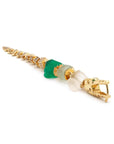 Bibi van der Velden Green Gradient Alligator Vertebrae Bite Earring. Crafted in 18K yellow gold, the alligator's body is formed by White Quartz, Green Amethyst, Green Agate while the head and tail are in solid 18K gold.  Photo shows earring laying down.