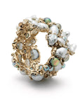 Bibi van der Velden Rock Pool Bracelet. A large cuff bracelet in 18k white gold and a dazzling cluster of Keshi pearls to create an organic shape with beautiful iridescent tones of blue, white, and grey pearls. The bracelet is further adorned with white diamonds.