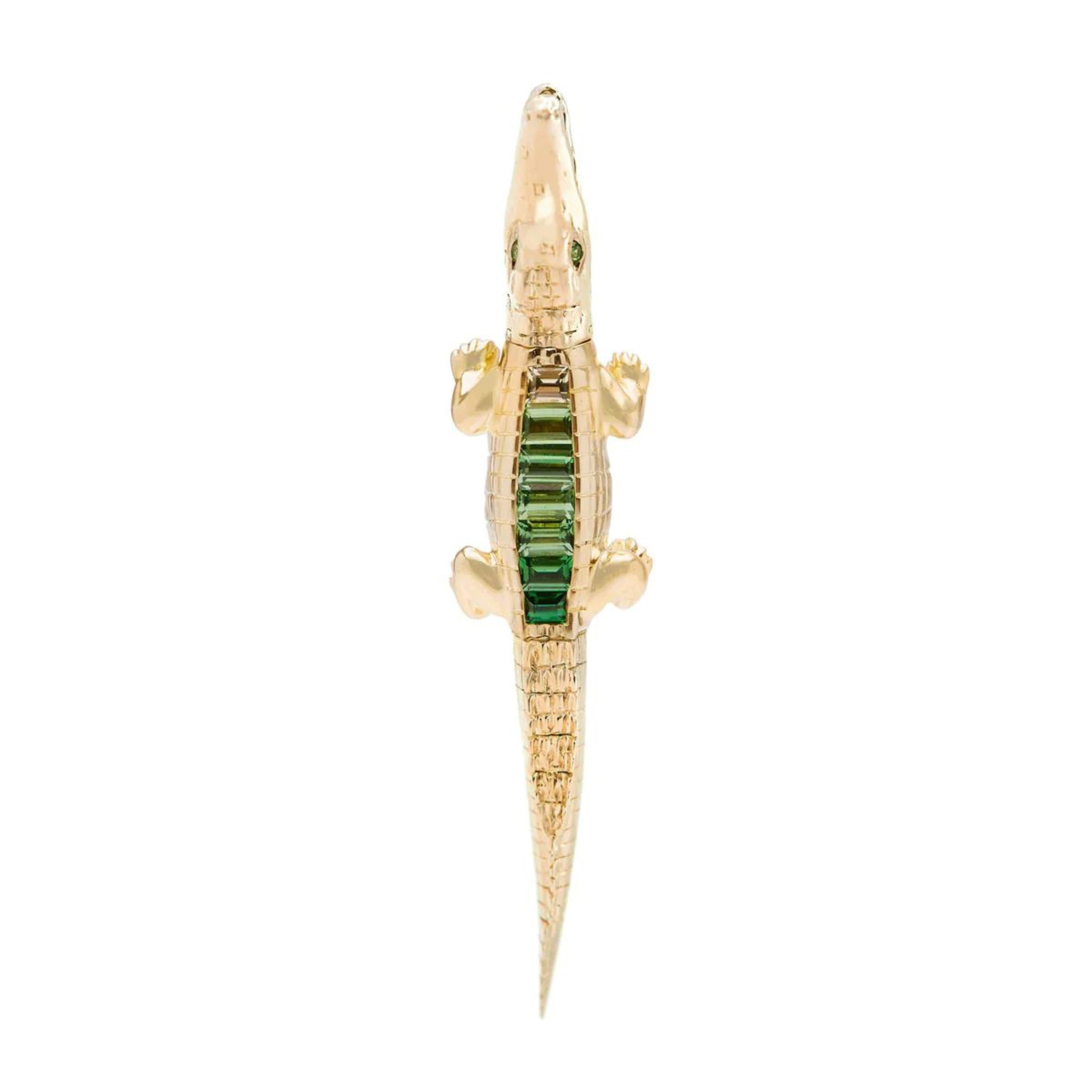 Bibi ven der Velden, Tsavorite Alligator Ear Bite Earring  Crafted in 18K yellow gold and featuring an arrangement of green tsavorites, the intricately carved design replicates an alligator&#39;s body. Shown from above.