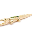 Bibi ven der Velden, Tsavorite Alligator Ear Bite Earring  Crafted in 18K yellow gold and featuring an arrangement of green tsavorites, the intricately carved design replicates an alligator's body.