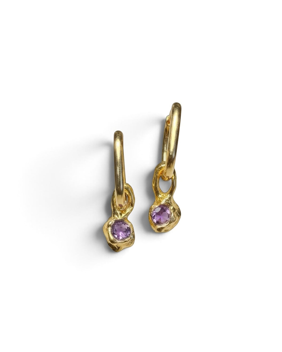 Two 18k gold vermeil hoop earrings with faceted amethyst drops, angled view on white background