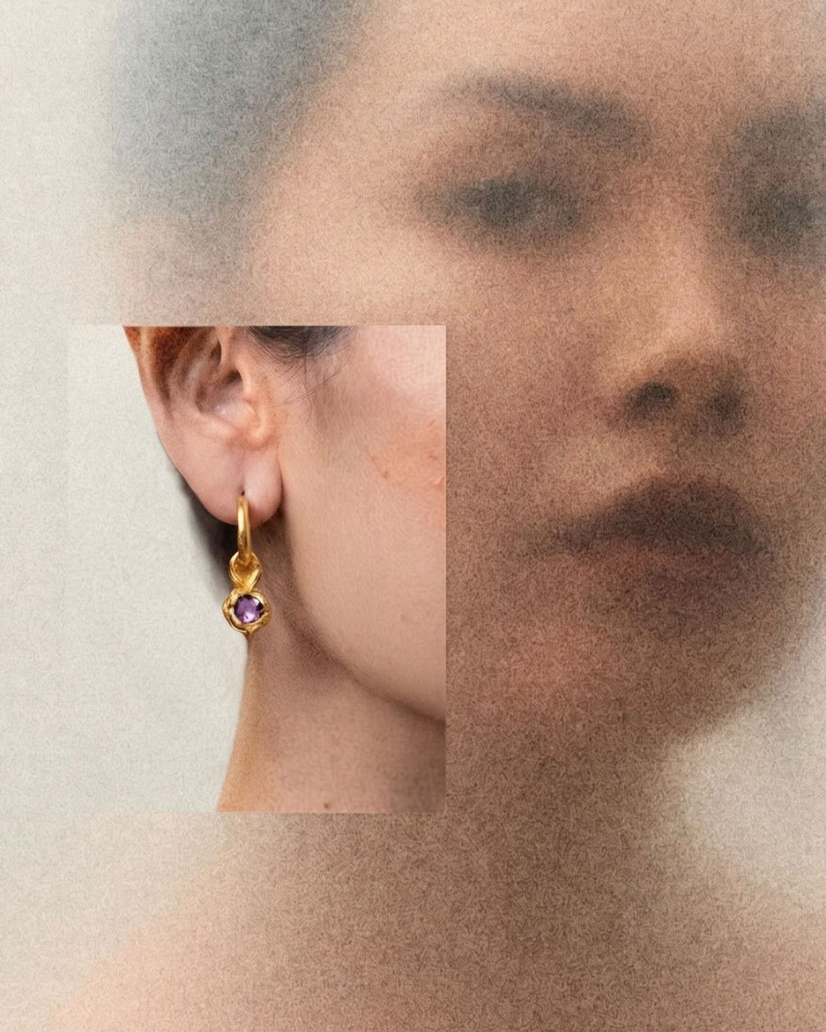 Close-up of an 18k gold vermeil amethyst drop earring worn on a model's ear