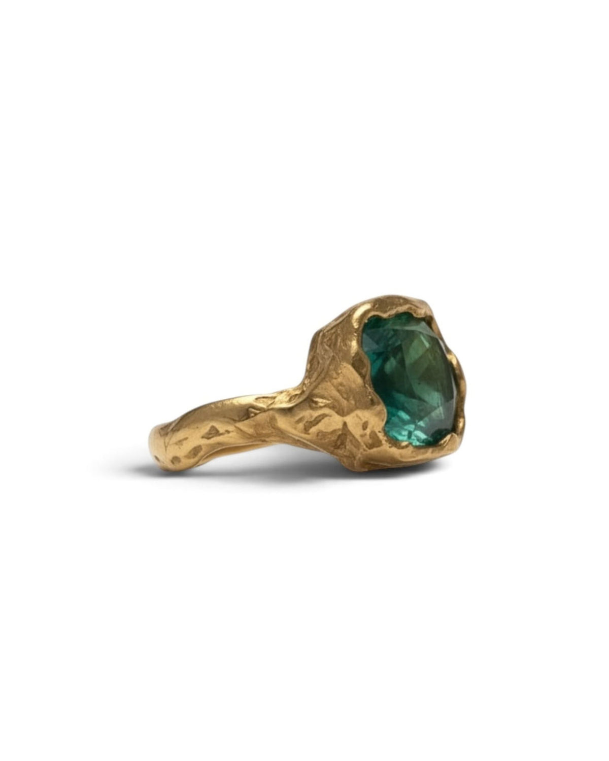 Side view of an 18k gold vermeil ring with a large faceted emerald-green stone, on white background
