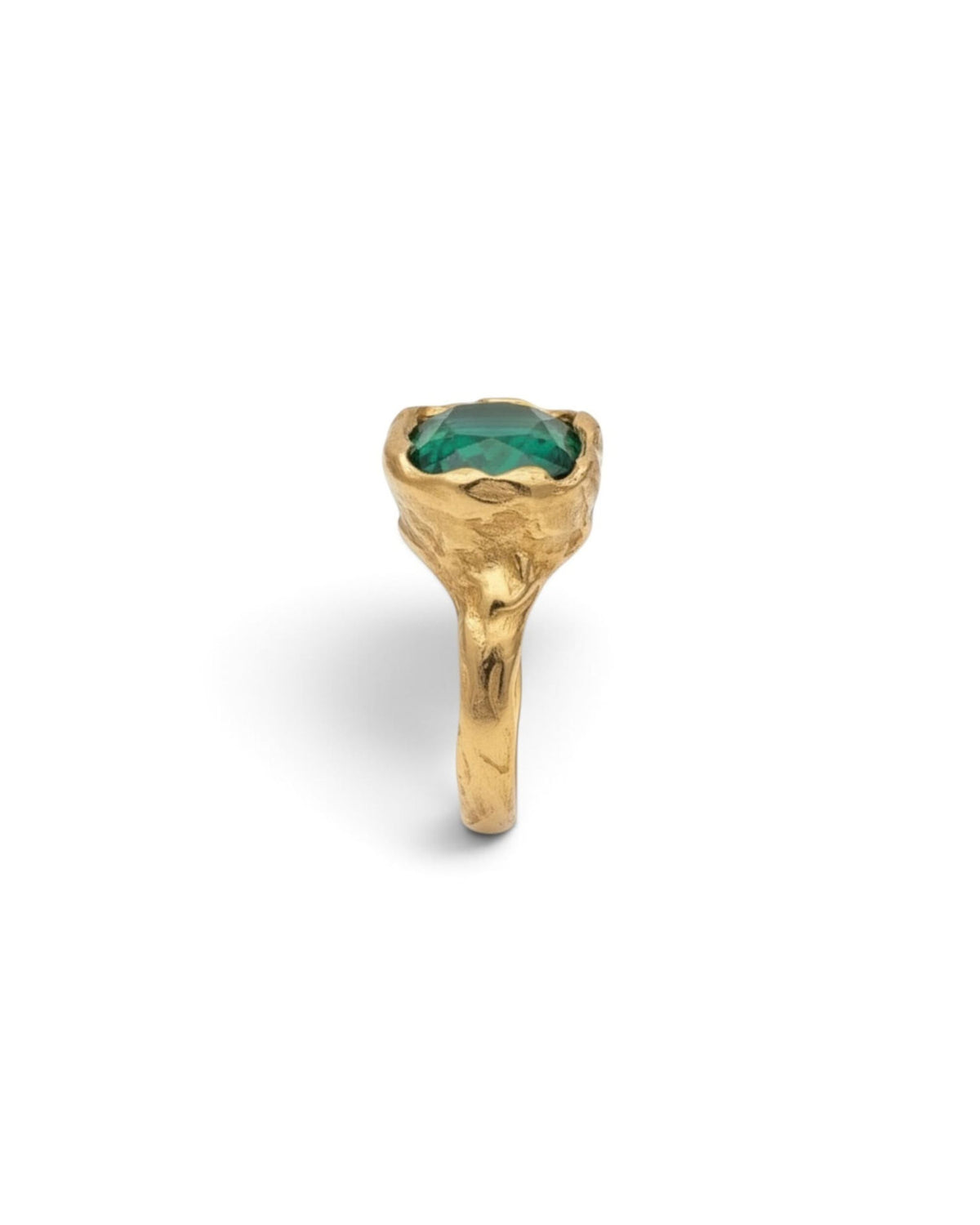 Side profile of an 18k gold vermeil ring with a large faceted emerald-green stone, on white background
