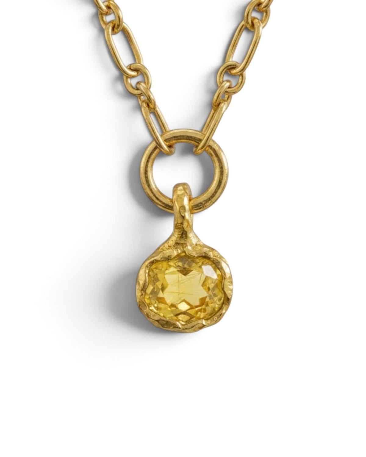 Close-up of an 18k gold vermeil necklace with a round faceted green gold quartz pendant, on white background