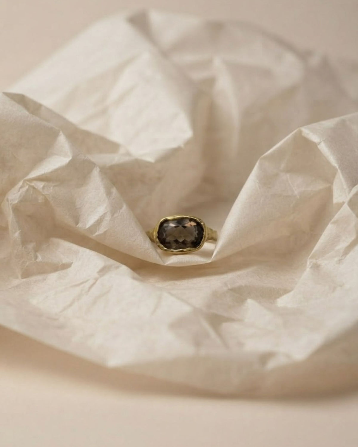 Camila D. Daneri Smoky Quartz Ring in gold vermeil, close-up nestled in tissue paper