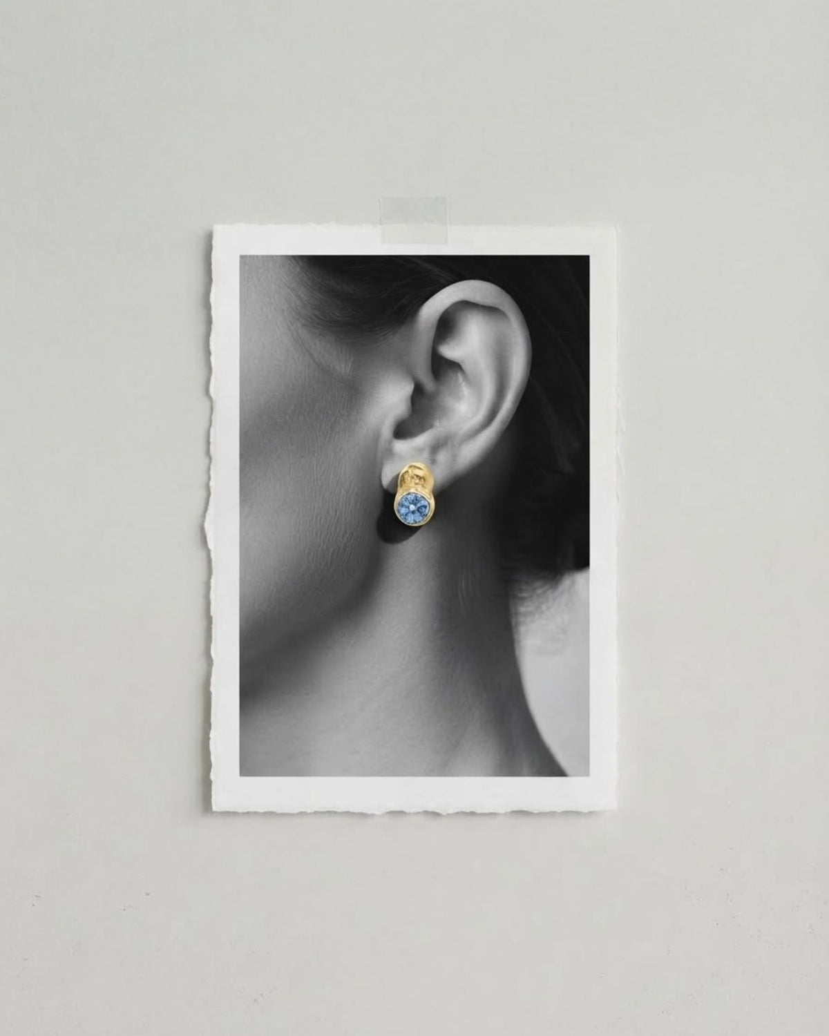 Camila D. Daneri Topaz Earrings, worn on model's ear, close-up black and white detail shot