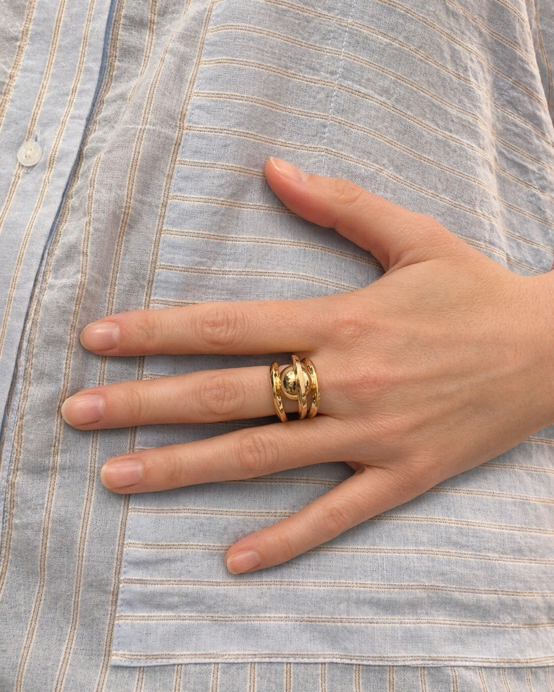 Françoise x Gas Bijoux Stellar gold ring worn on finger, showing scale and band width